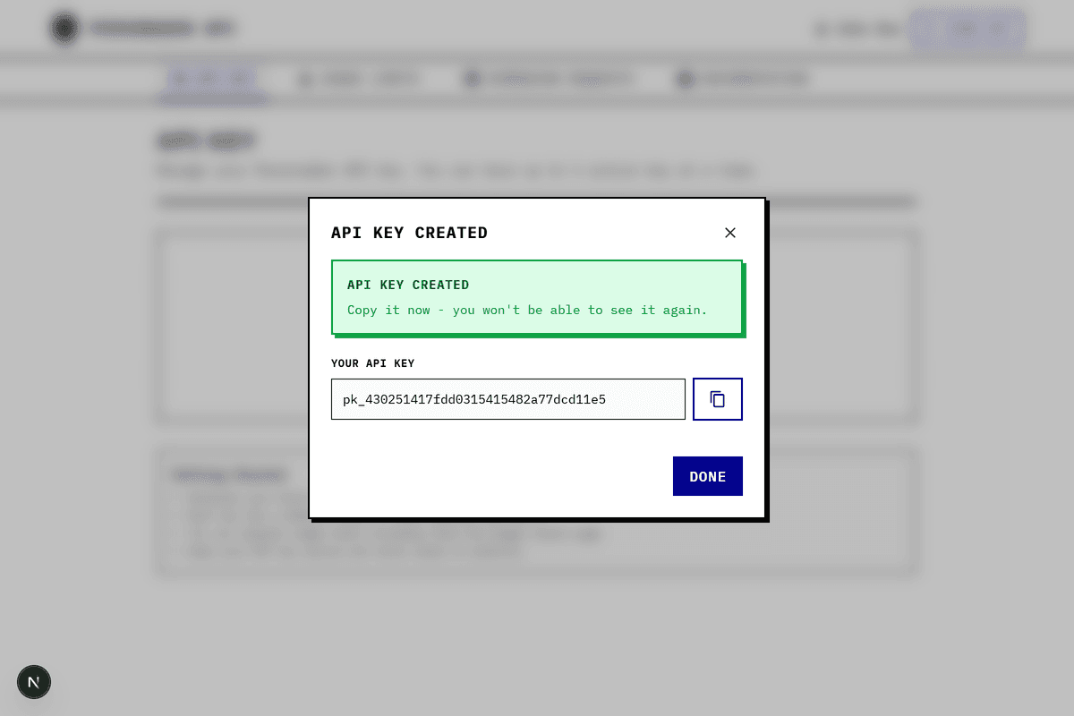 API Key created successfully dialog showing the full key with copy button
